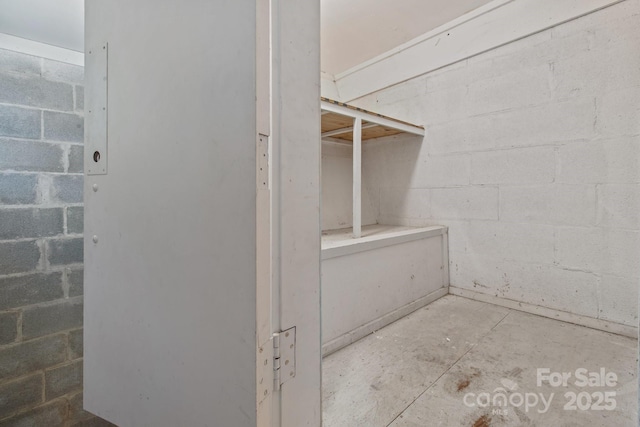 405 E 18th St, Kannapolis, NC 28083 - bathroom with unfinished concrete flooring and concrete block wall