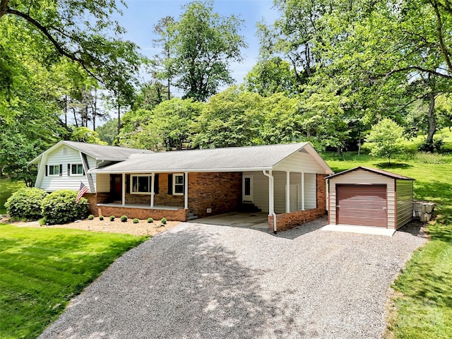 110 Stoney Brook Dr, Clyde, NC 28721 - tri-level home featuring driveway, an outbuilding, a carport, a porch, and a front lawn