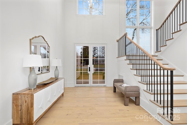 1321 Ferncliff Rd, Charlotte, NC 28211 - foyer entrance with a towering ceiling, stairway, and wood finished floors