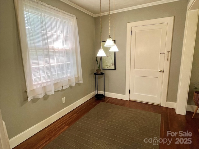 511 Westview St SW, Lenoir, NC 28645 - unfurnished dining area featuring dark wood-style flooring, baseboards, and crown molding