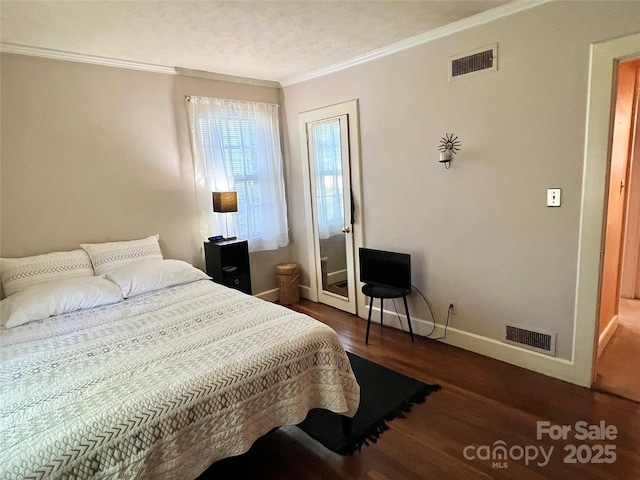 511 Westview St SW, Lenoir, NC 28645 - bedroom featuring crown molding, wood finished floors, and baseboards