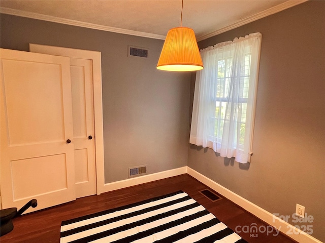 511 Westview St SW, Lenoir, NC 28645 - spare room featuring dark wood-style flooring, baseboards, and ornamental molding