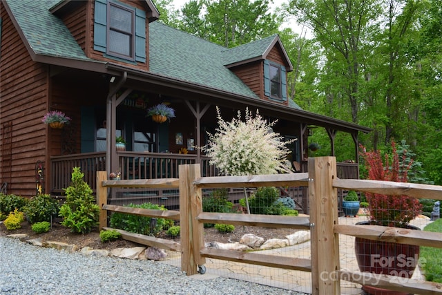 394 Hummingbird Ln, Elk Park, NC 28622 - view of property exterior with a shingled roof, covered porch, and a gate