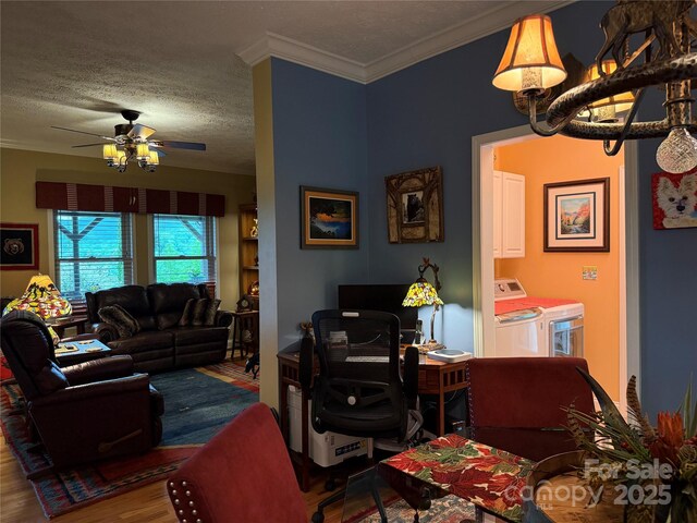 394 Hummingbird Ln, Elk Park, NC 28622 - living area with washing machine and clothes dryer, ceiling fan, wood finished floors, ornamental molding, and a textured ceiling