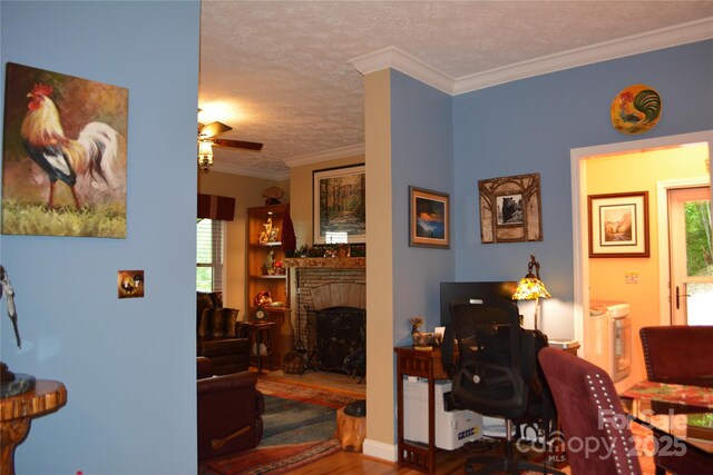 394 Hummingbird Ln, Elk Park, NC 28622 - office featuring ceiling fan, a fireplace, wood finished floors, a textured ceiling, and ornamental molding