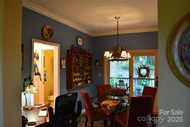 394 Hummingbird Ln, Elk Park, NC 28622 - dining area with a chandelier, ornamental molding, and baseboards