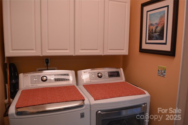 394 Hummingbird Ln, Elk Park, NC 28622 - laundry room featuring washer and clothes dryer and cabinet space
