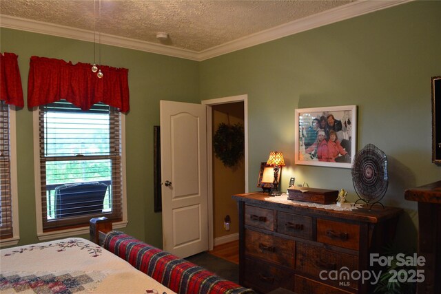 394 Hummingbird Ln, Elk Park, NC 28622 - bedroom featuring a textured ceiling, crown molding, and wood finished floors