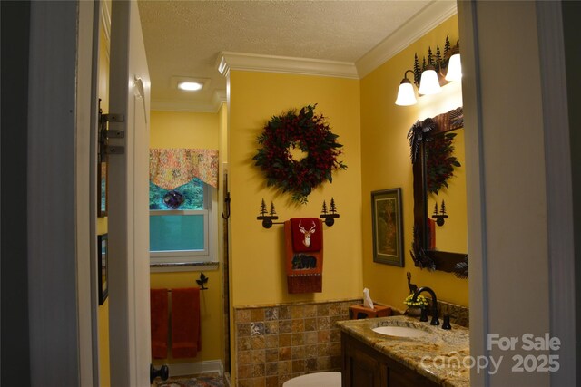 394 Hummingbird Ln, Elk Park, NC 28622 - half bathroom with vanity, ornamental molding, toilet, and a textured ceiling
