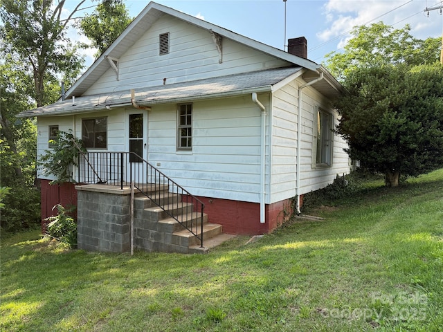 28 Central Ave, Granite Falls, NC 28630 - back of house with a chimney and a lawn