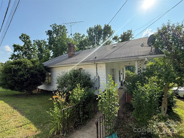 28 Central Ave, Granite Falls, NC 28630 - view of front facade featuring a front lawn and a chimney