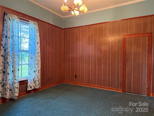 28 Central Ave, Granite Falls, NC 28630 - spare room with a chandelier, carpet, crown molding, and wooden walls