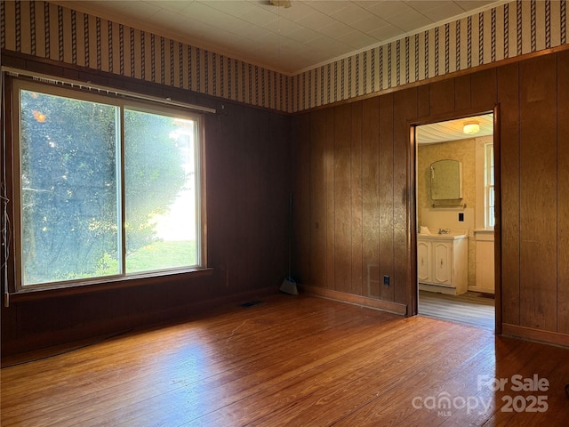 28 Central Ave, Granite Falls, NC 28630 - unfurnished room featuring wood finished floors and wooden walls