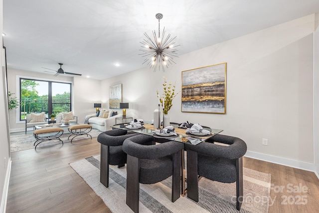 411 Devender Ln NE Unit 5, Charlotte, NC 28217 - dining room with wood finished floors, baseboards, recessed lighting, a chandelier, and a ceiling fan