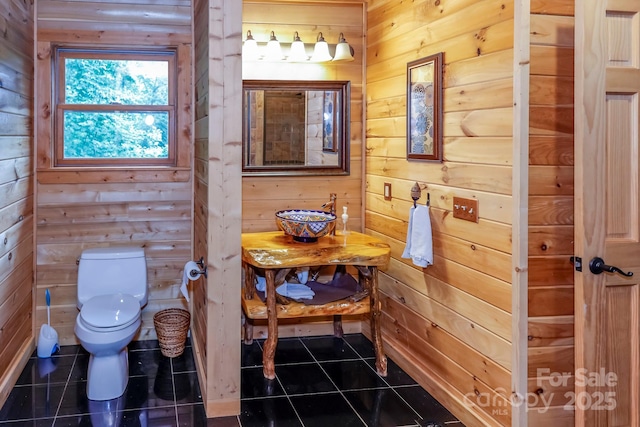 184 Sunlight Path, Lake Lure, NC 28746 - half bath featuring wood walls and tile patterned flooring