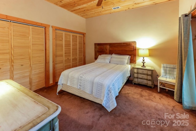184 Sunlight Path, Lake Lure, NC 28746 - bedroom with multiple closets, carpet floors, wood ceiling, and ceiling fan