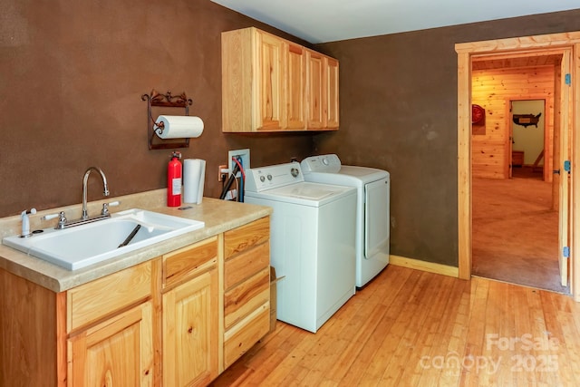 184 Sunlight Path, Lake Lure, NC 28746 - laundry room with washing machine and clothes dryer, cabinet space, and light wood-style flooring