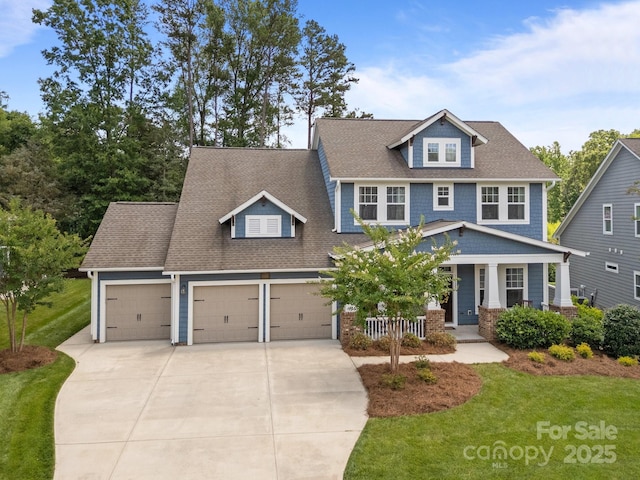 11329 Fullerton Place Dr NW, Huntersville, NC 28078 - view of front of property with a garage, a porch, driveway, and a front yard