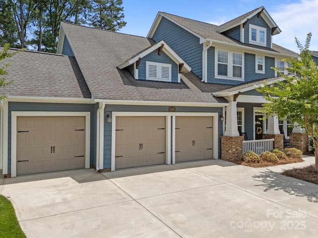 11329 Fullerton Place Dr NW, Huntersville, NC 28078 - view of front of property featuring covered porch, driveway, an attached garage, and a shingled roof