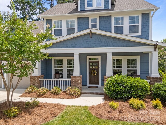 11329 Fullerton Place Dr NW, Huntersville, NC 28078 - view of front of house with a porch and roof with shingles