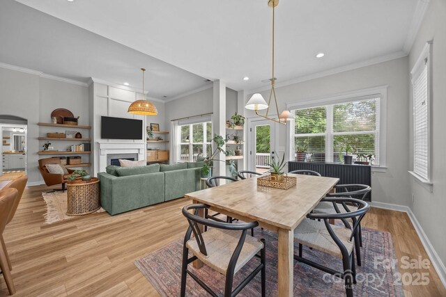 11329 Fullerton Place Dr NW, Huntersville, NC 28078 - dining space featuring recessed lighting, light wood-style flooring, ornamental molding, a fireplace, and baseboards