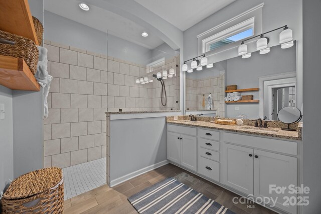 11329 Fullerton Place Dr NW, Huntersville, NC 28078 - full bathroom featuring a walk in shower, double vanity, recessed lighting, and wood finished floors