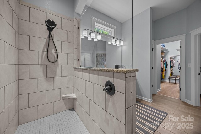 11329 Fullerton Place Dr NW, Huntersville, NC 28078 - full bathroom featuring a walk in shower, wood finished floors, and a walk in closet