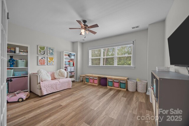 11329 Fullerton Place Dr NW, Huntersville, NC 28078 - sitting room with a ceiling fan and light wood finished floors