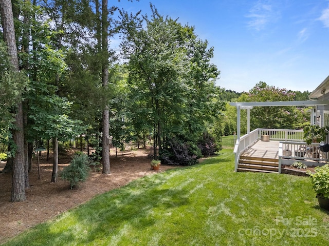 11329 Fullerton Place Dr NW, Huntersville, NC 28078 - view of green lawn with a wooden deck and a pergola