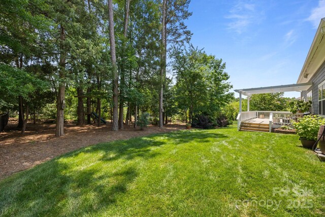 11329 Fullerton Place Dr NW, Huntersville, NC 28078 - view of green lawn featuring a wooden deck