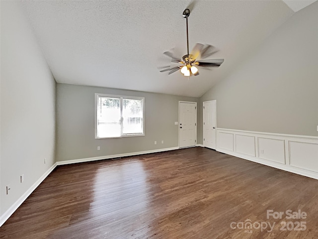 120 Todd Dr NW, Concord, NC 28025 - unfurnished room with lofted ceiling, a ceiling fan, dark wood-type flooring, and a textured ceiling