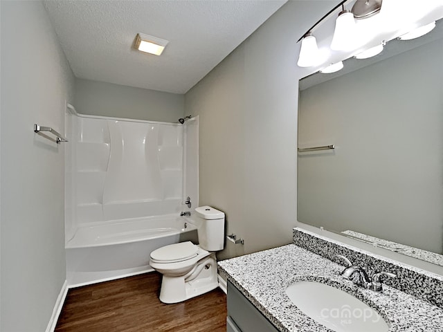 120 Todd Dr NW, Concord, NC 28025 - full bathroom featuring toilet, vanity, wood finished floors, bathing tub / shower combination, and a textured ceiling