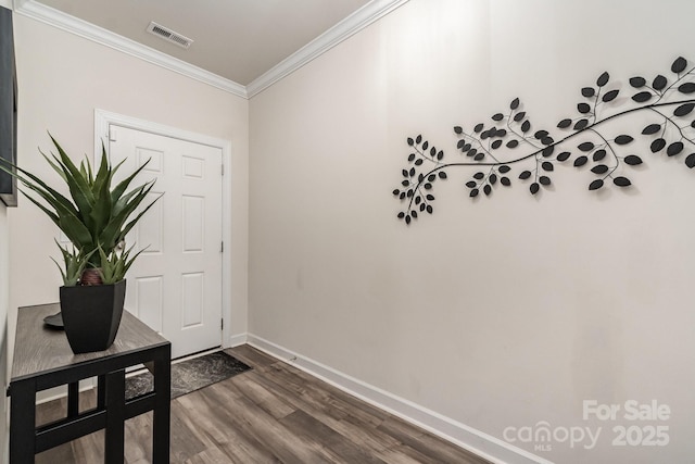 9274 Dunwich Dr, Gastonia, NC 28056 - doorway with dark wood finished floors, ornamental molding, and baseboards