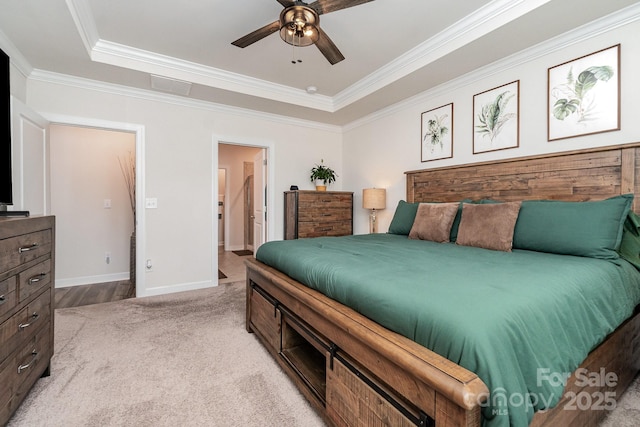 9274 Dunwich Dr, Gastonia, NC 28056 - bedroom with a tray ceiling, crown molding, light colored carpet, baseboards, and ceiling fan