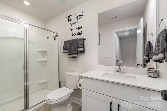 9274 Dunwich Dr, Gastonia, NC 28056 - bathroom featuring vanity, a stall shower, toilet, baseboards, and recessed lighting