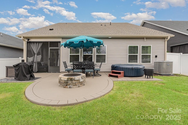 9274 Dunwich Dr, Gastonia, NC 28056 - back of house featuring a hot tub, a patio, a fire pit, cooling unit, and a sunroom