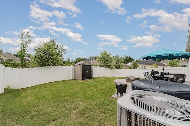 9274 Dunwich Dr, Gastonia, NC 28056 - view of yard featuring a fire pit, central AC, and a patio