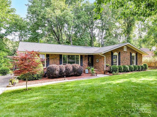 13617 Lake Bluff Dr, Matthews, NC 28105 - ranch-style home featuring brick siding, a front lawn, and roof with shingles