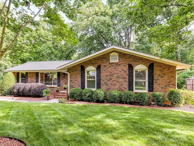 13617 Lake Bluff Dr, Matthews, NC 28105 - ranch-style home with brick siding and a front lawn