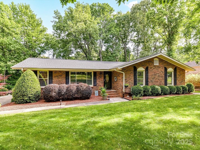 13617 Lake Bluff Dr, Matthews, NC 28105 - ranch-style home with brick siding and a front lawn