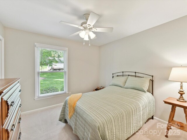 13617 Lake Bluff Dr, Matthews, NC 28105 - bedroom featuring light colored carpet, baseboards, and ceiling fan