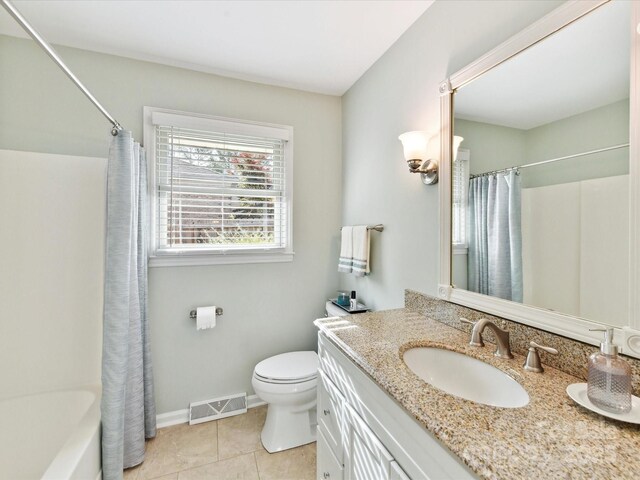 13617 Lake Bluff Dr, Matthews, NC 28105 - bathroom with vanity, toilet, tile patterned flooring, baseboards, and shower / bath combination with curtain