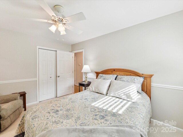 13617 Lake Bluff Dr, Matthews, NC 28105 - bedroom featuring a closet, baseboards, carpet flooring, and a ceiling fan