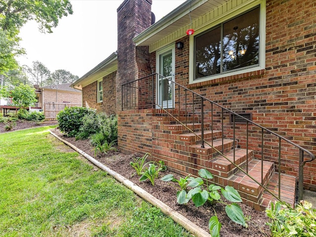 13617 Lake Bluff Dr, Matthews, NC 28105 - view of side of property with brick siding, a chimney, and a lawn