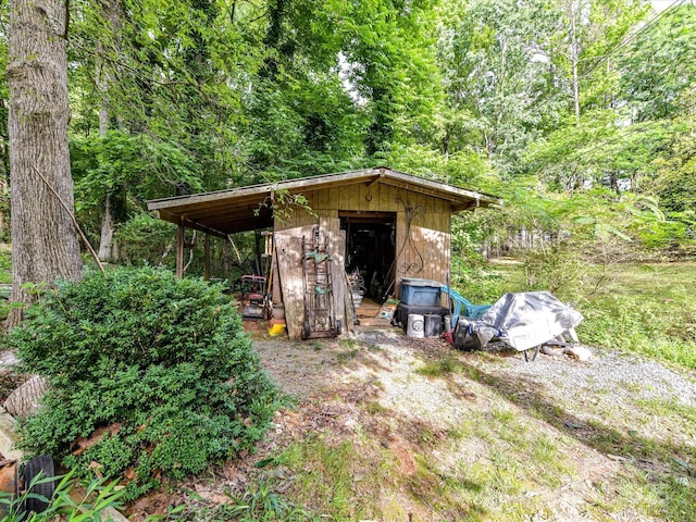 13617 Lake Bluff Dr, Matthews, NC 28105 - view of shed featuring a wooded view