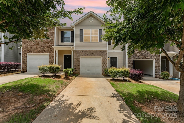 8953 Bradstreet Commons Way, Charlotte, NC 28215 - view of front of home with driveway, stone siding, and a garage