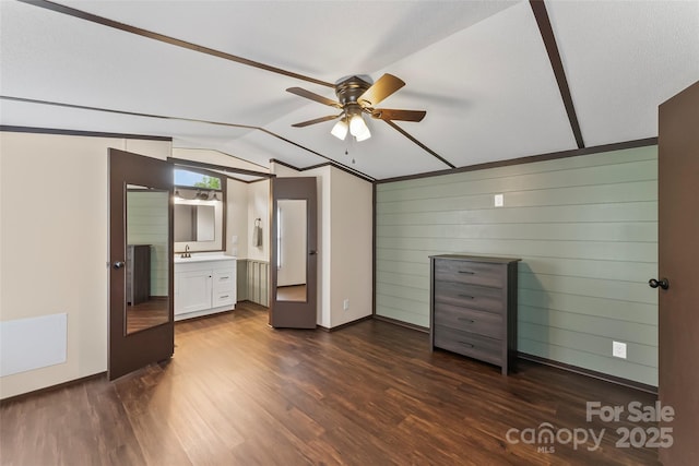 1712 NC-126 Hwy, Morganton, NC 28655 - unfurnished bedroom with lofted ceiling, dark wood finished floors, a sink, baseboards, and ensuite bathroom
