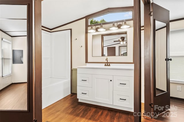 1712 NC-126 Hwy, Morganton, NC 28655 - bathroom featuring a ceiling fan, vanity, wood finished floors, crown molding, and shower / tub combination