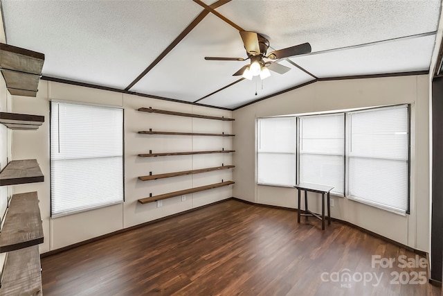 1712 NC-126 Hwy, Morganton, NC 28655 - spare room featuring lofted ceiling, dark wood-style flooring, healthy amount of natural light, a ceiling fan, and a textured ceiling