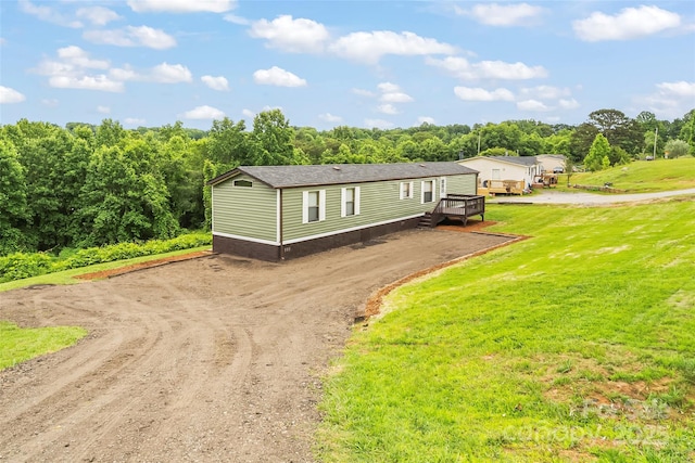 1712 NC-126 Hwy, Morganton, NC 28655 - manufactured / mobile home with dirt driveway, a deck, and a front yard